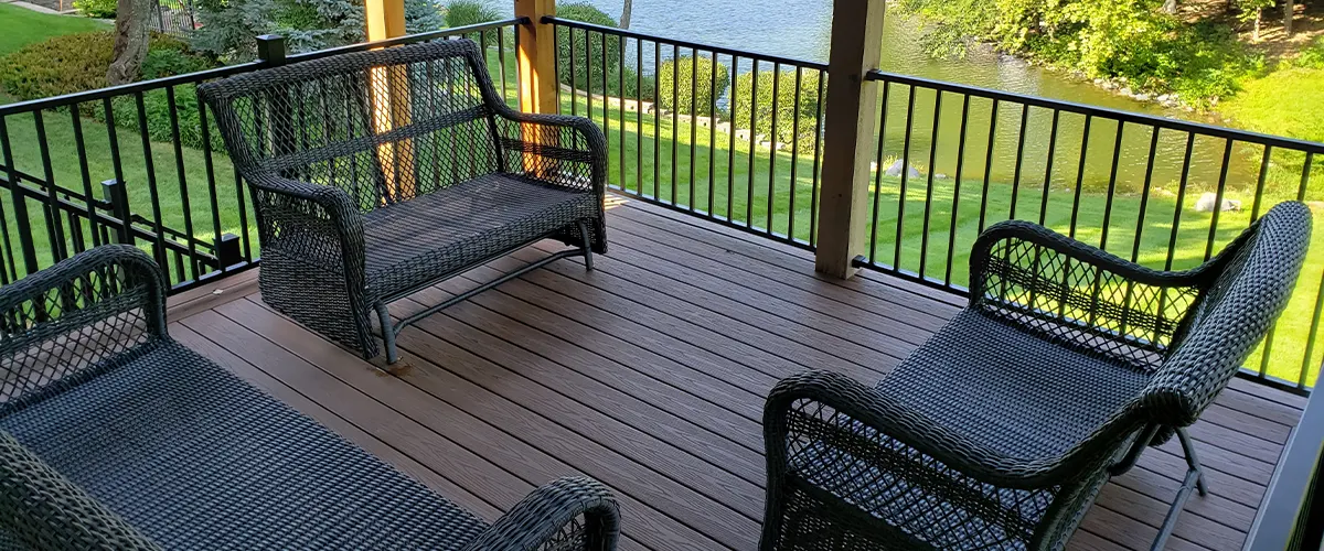 A low-maintenance composite decking with chairs and railings