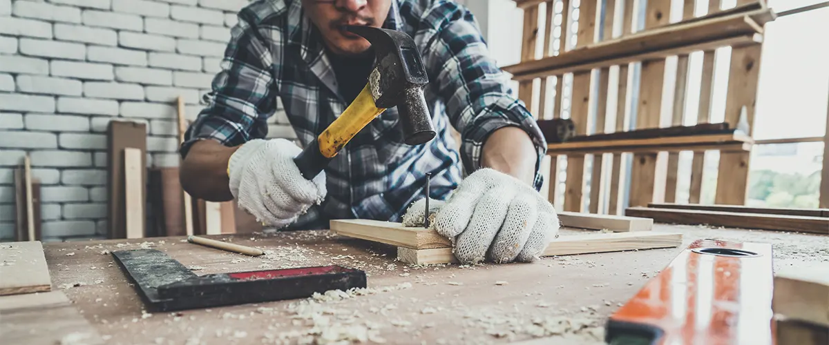 A carpenter working on a deck