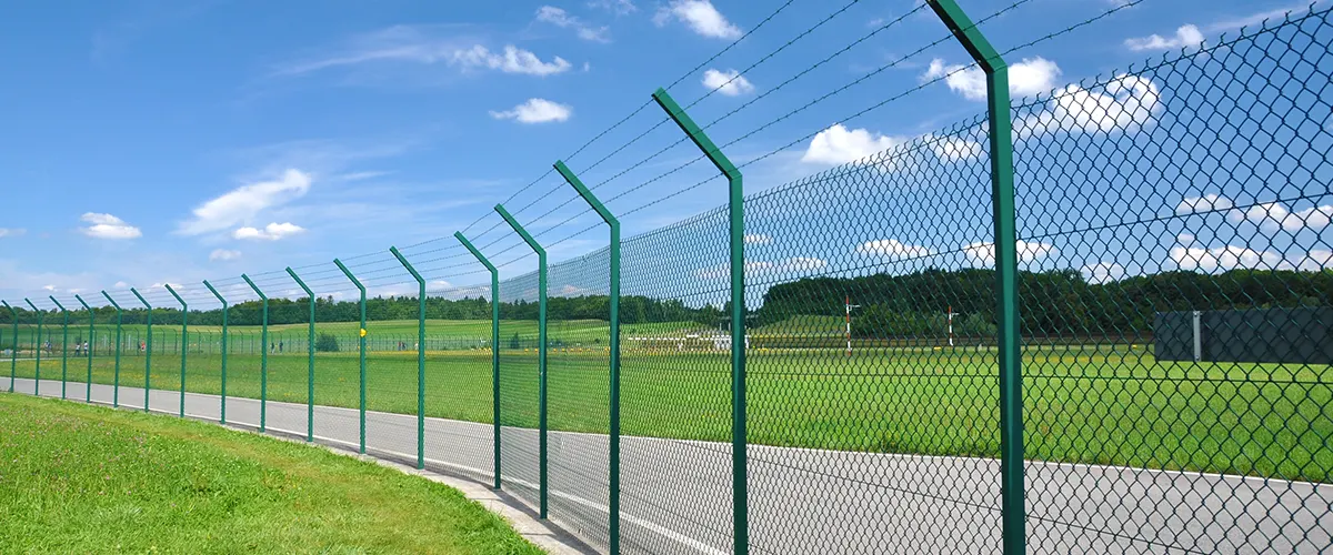 A barbed wire fence material in an open field