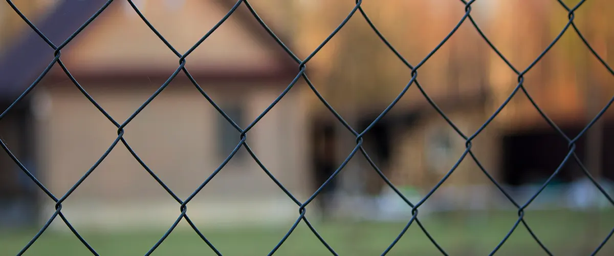 A close up with a chain link fence