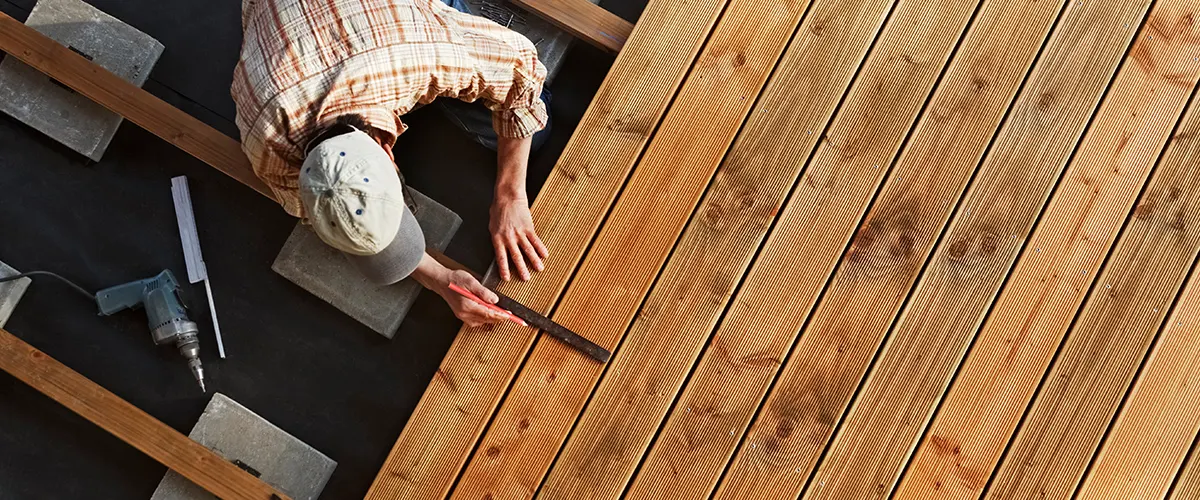 contractor replacing decking boards