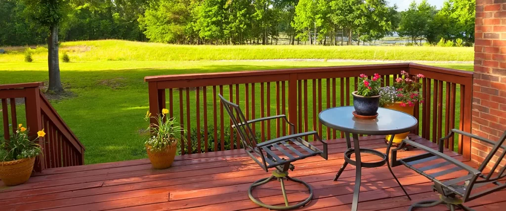 green backyard and wooden deck