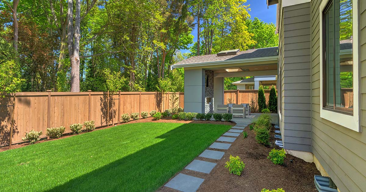 green backyard and wood fence