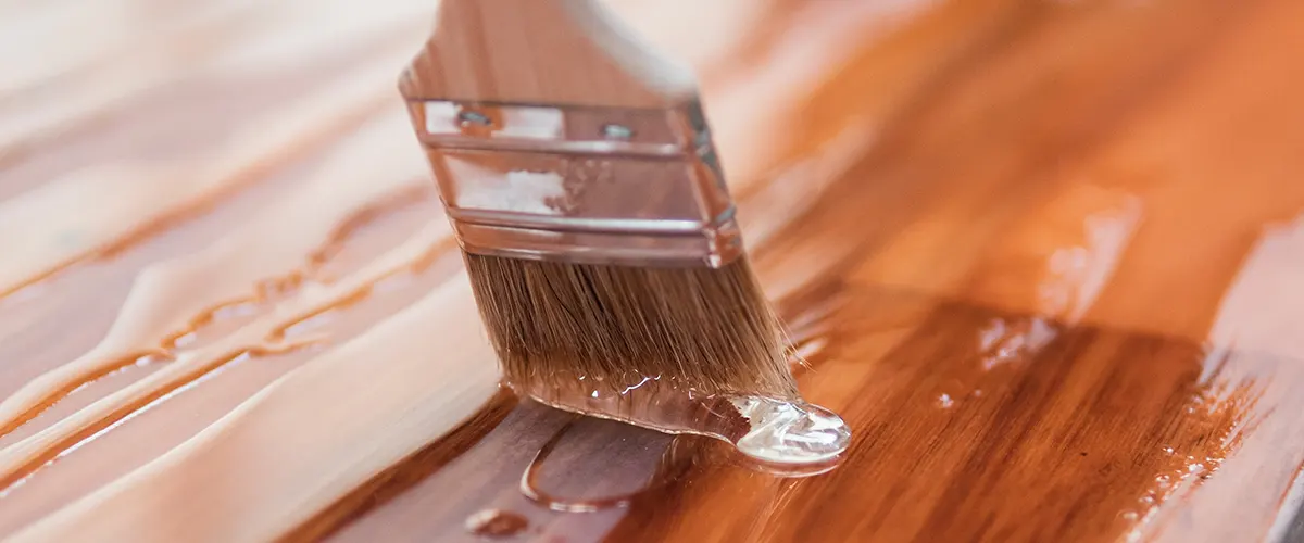 paintbrush with stain on wood
