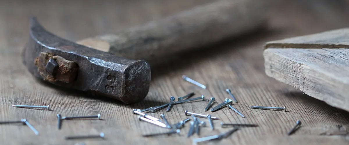 A hammer and some nails to reuse an old deck framing