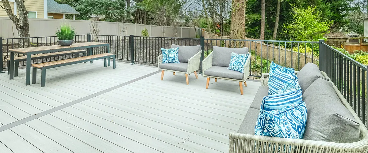 boho deck and grey couch with blue cushions