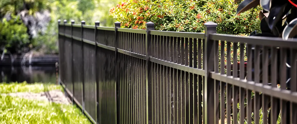 black-metal-fence-with-green-background