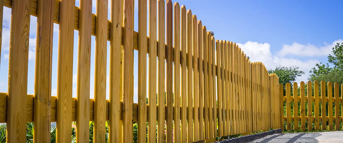Wooden fence with cedar pickets